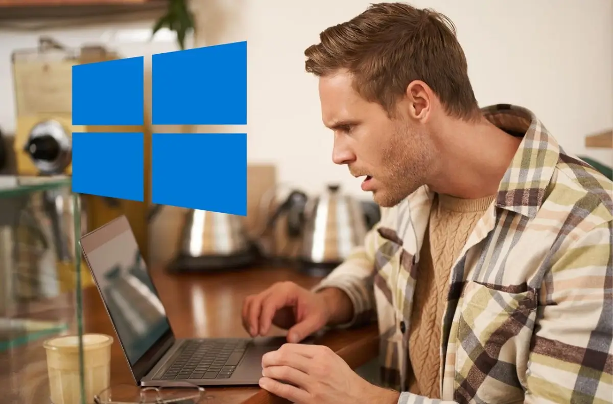 muž s notebookem a Windows 10